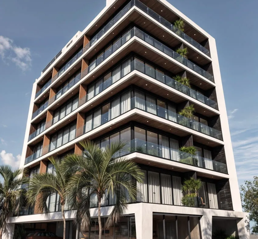 una fachada de un edificio de departamentos en macondo punta esmeralda playa del carmen