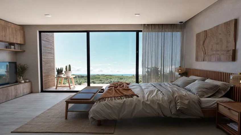 un cama king size y un balcon en macondo punta esmeralda playa del carmen