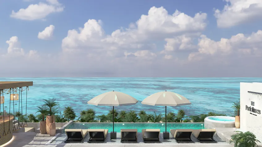 una alberca con camastros y vista al mar en portofino 28 playa del carmen