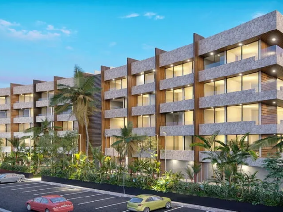 una fachada de un edificio de departamentos en distrito norte cozumel