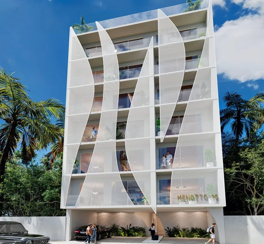 una fachada de un edificio en menotto 10 playa del carmen