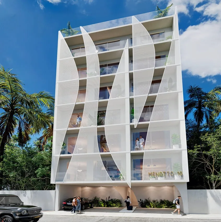 una fachada de un edificio en menotto 10 playa del carmen