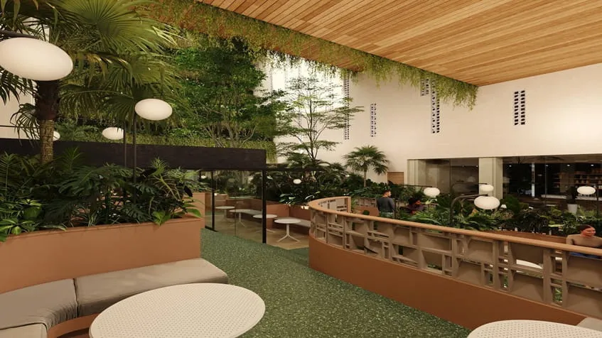 un interior de un restaurante con mesas y sillas en solar playa studios playa del carmen