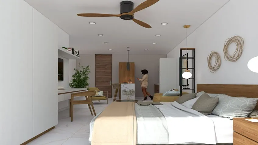 una recamara de un estudio con una cama king size en ola de mar playa del carmen