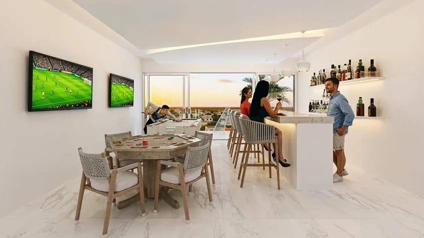 un sport bar con personas conviviendo en menotto 10 playa del carmen