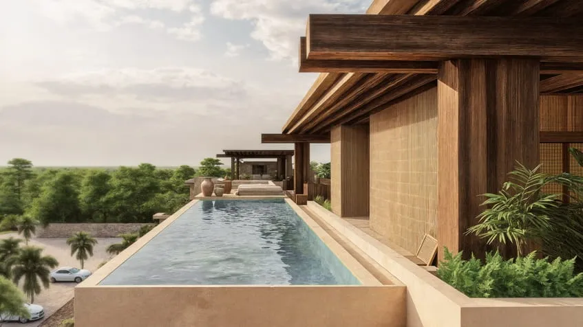 una piscina con vista a las areas verdes del exterior en anamaya cozumel