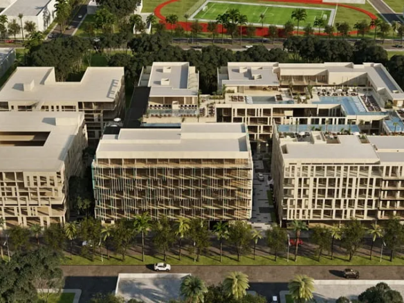 una vista aerea de un edificio de departamentos en serenada playa del carmen