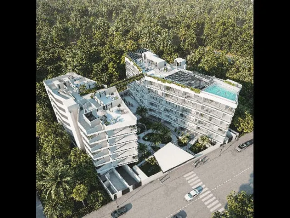 fachada y vista aerea de un edificio en reserva sole playa del carmen