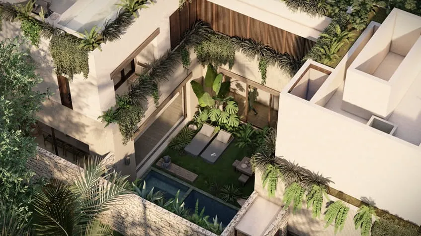 una vista aerea del exterior de una villa con una piscina privada y camastros en anamaya cozumel